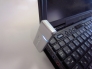 ThinkpadにUDSS01を装着した所。100円ライターの2/3位の大きさです。